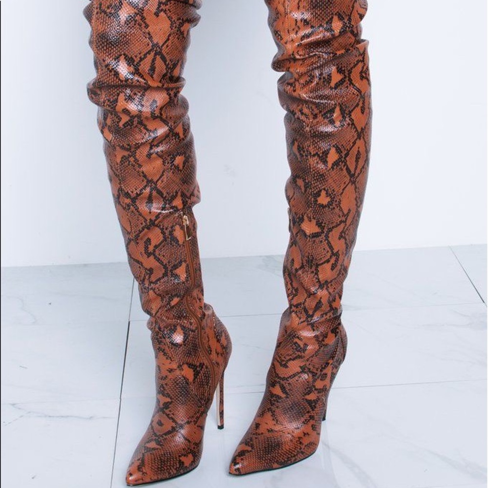 Snakeskin over the knee boots